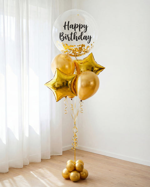"Bouquet de Globos Happy Birthday con Helio — Dorado" en dorado con burbuja de confeti, estrellas foil y globos chrome — Perú Balloons, Lima